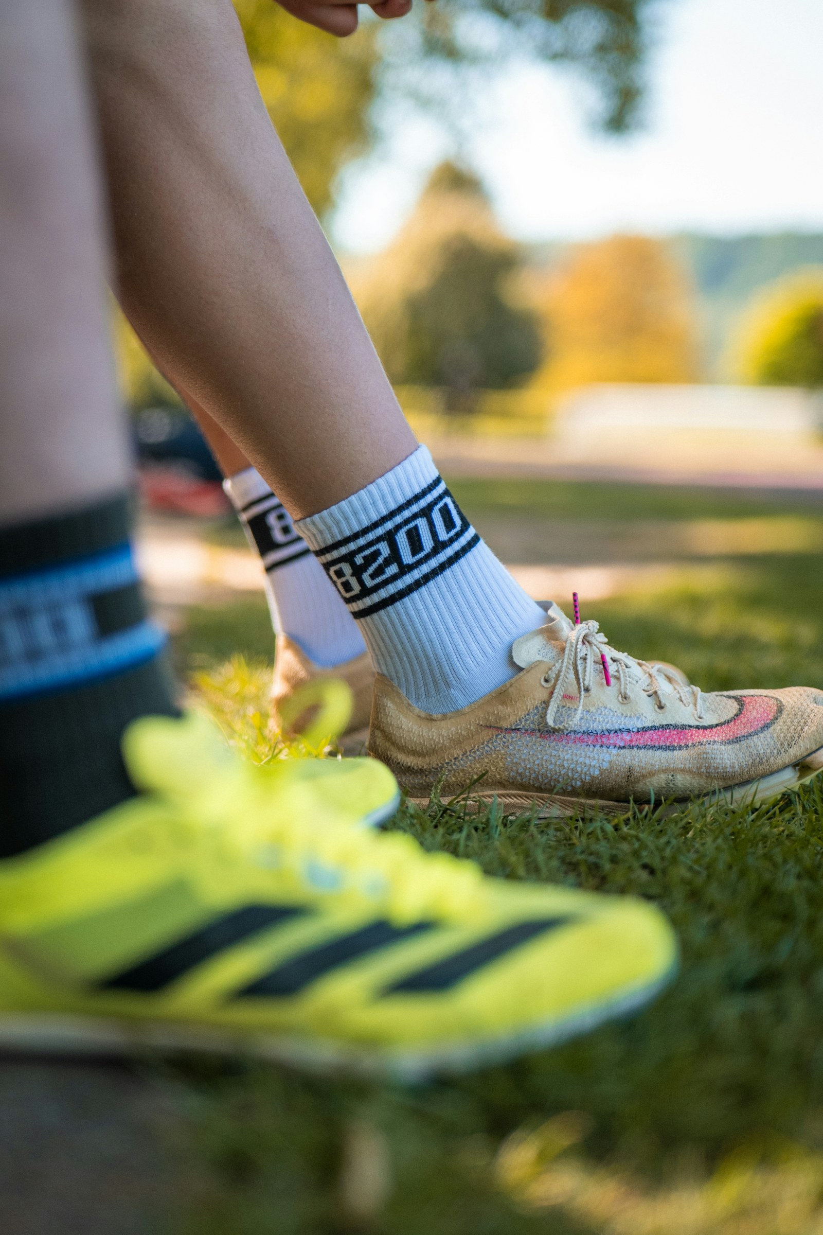 Running shoes and socks on grass