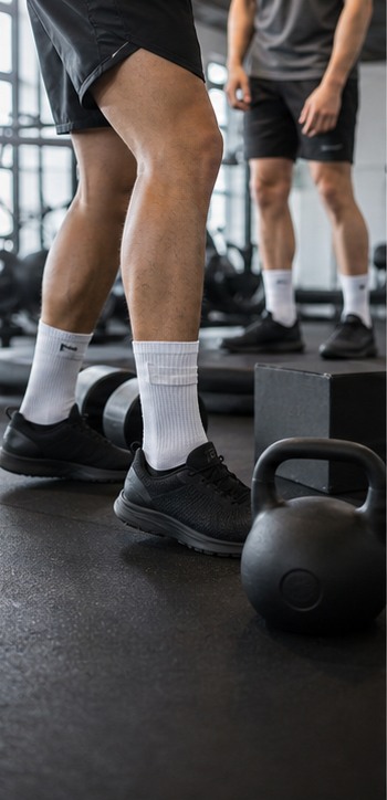 Running event organizer preparing branded socks