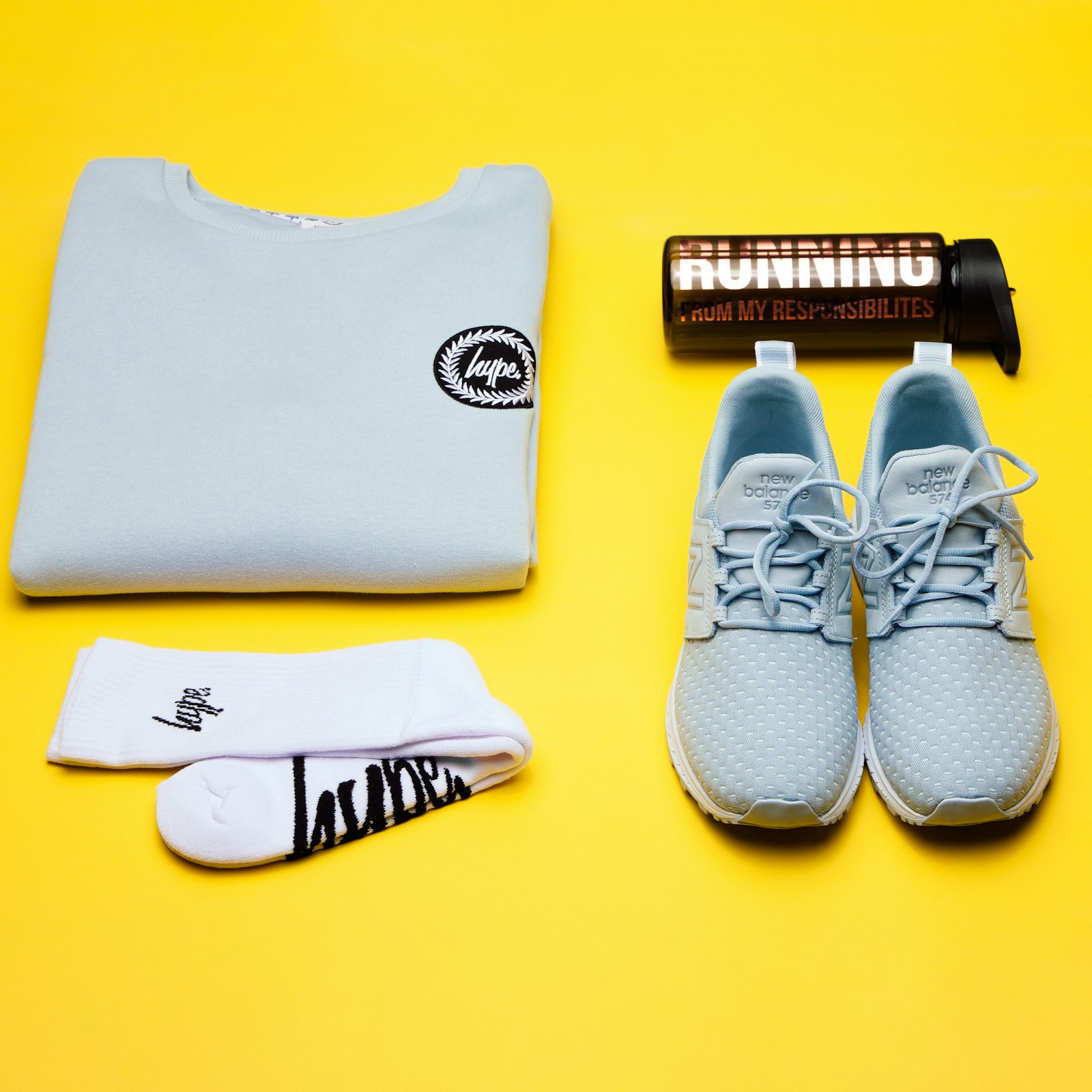 Running shoes, socks and water bottle
