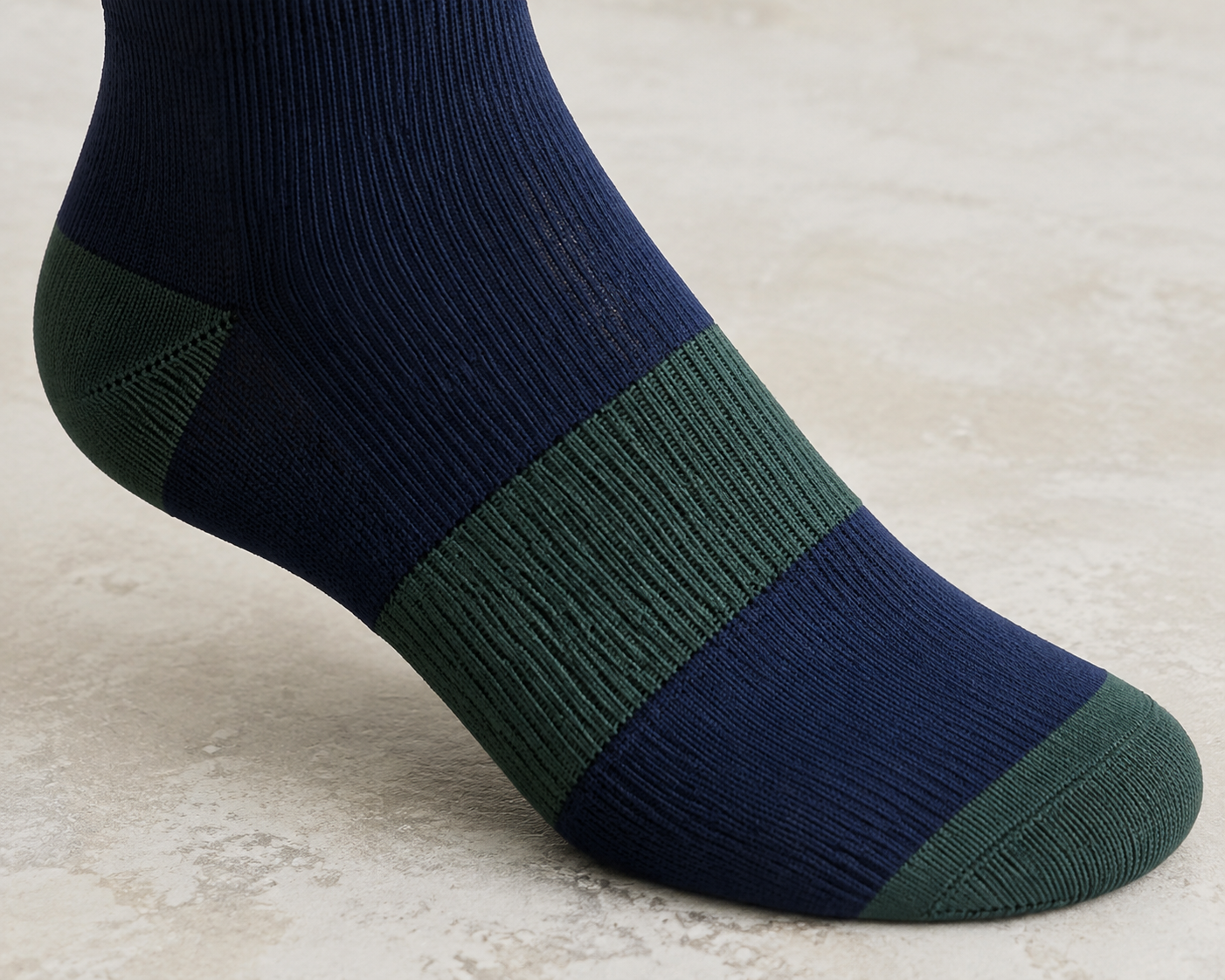 Illustrative arch-band knit direction on a riding sock