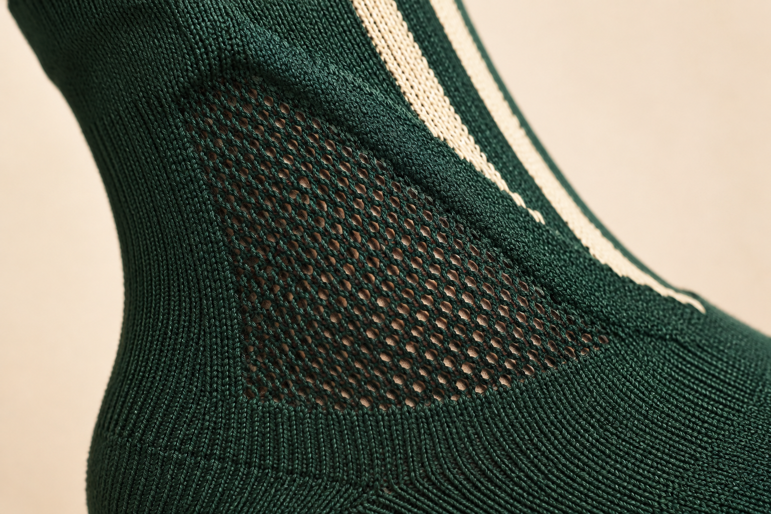 Close-up of an open breathable mesh zone knitted into a softball sock